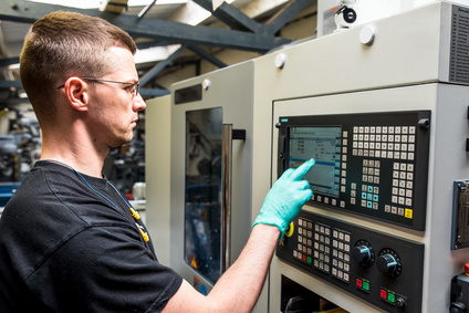 Person Programming a CNC Machine